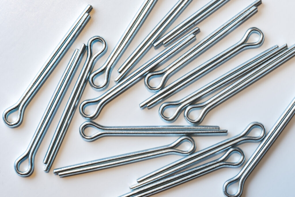 A group of cotter pins on a white background